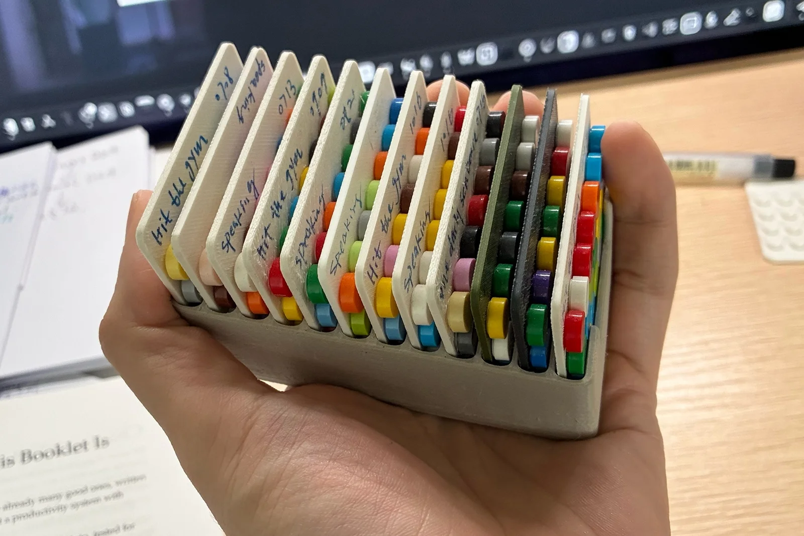 Louis holds a custom container filled with completed baseplates.
